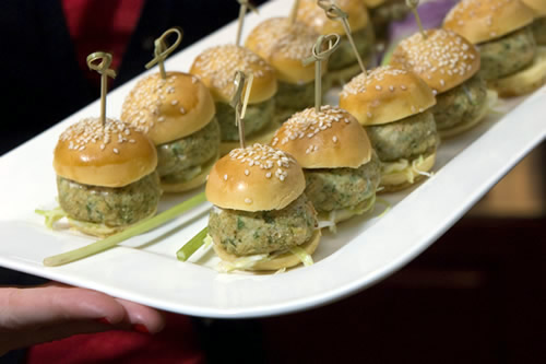 Close-up of tuna sliders with cabbage slaw and lemon aioli on sesame seed brioche buns